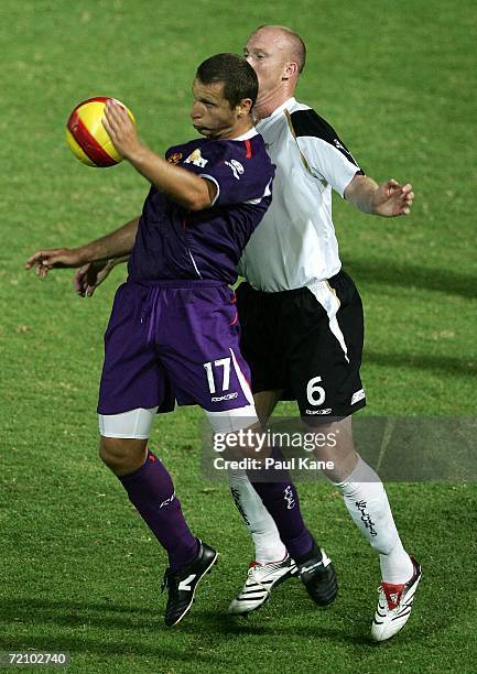 Stuart Young of the Glory and Neil Emblen of the Knights contest the ball during the round seven Hyundai A-League match between Perth Glory and the...