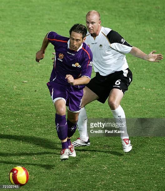 Bobby Despotovski of the Glory and Neil Emblen of the Knights contest the ball during the round seven Hyundai A-League match between Perth Glory and...