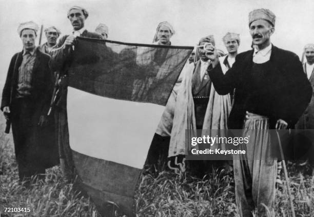 French troops with a recaptured tricolour during the Algerian War of Independence, 1956.