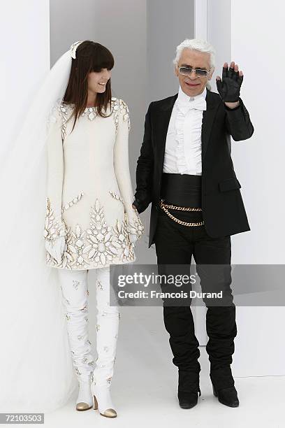 Destinger Karl Lagerfeld and one of his models are seen on the runway at the end of his Chanel Haute Couture Fall-Winter 2006/07 Fashion show during...