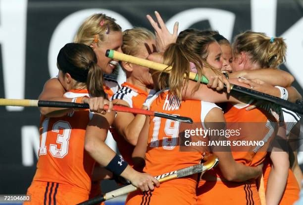 Netherlands' players celebrate after scoring a goal against Argentina during their Women's World Cup semi-final Field Hockey match in Madrid, 06...