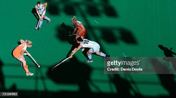 Eefke Mulder of the Netherlands is challanged by Agustina Garcia of Argentina during the Netherlands v Argentina semi-final match in the Womens World...