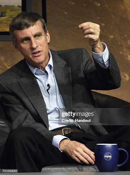 In this handout photo provided by NASA, Steve Squyres, Principal Investigator of the Mars Rovers, Cornell University, talks to the media during a...