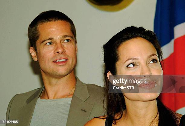 In this file photograph dated 07 June 2006, Hollywood couple Angelina Jolie and Brad Pitt gives a press conference at a Swakopmund hotel after...