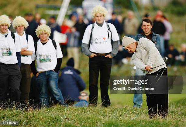 Actor Michael Douglas plays his second shot to the 2nd hole while being watched by Colin Montgomerie fans during the Third Round of The Alfred...