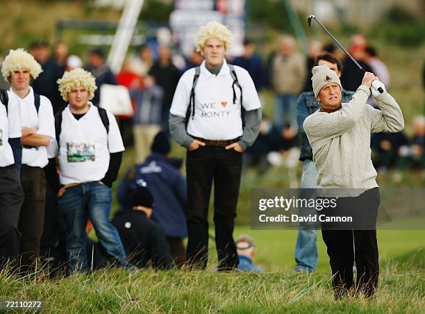 Actor Michael Douglas plays his second shot to the 2nd Hole while being watched by Colin Montgomerie fans during the Third Round of The Alfred...