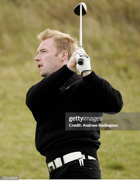 Ronan Keating, the Irish singer, hits his second shot on the first hole during the third round of The Alfred Dunhill Links Championship at Kingsbarns...