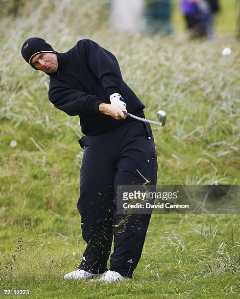 England cricketer Michael Vaughan plays his second shot at the 18th hole during the Third Round of The Alfred Dunhill Links Championship at...