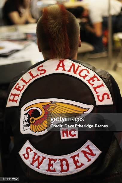 Hell's Angel waits to be tattooed during day two of the second British international tattoo event on October 7, 2006 at The Old Truman Brewery in...