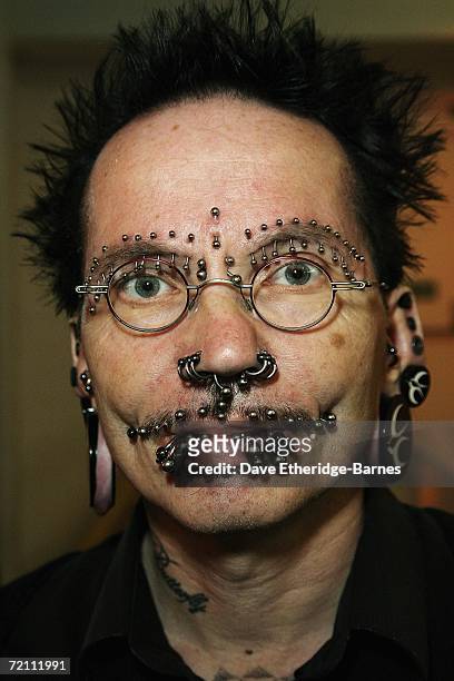 Heavily pierced man poses during day two of the second British international tattoo event on October 7, 2006 at The Old Truman Brewery in Brick Lane,...