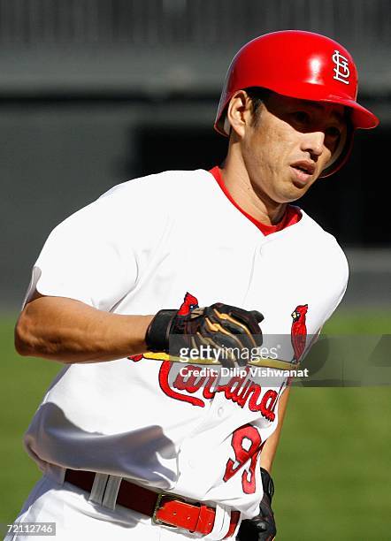 So Taguchi of the St. Louis Cardinals rounds the bases after hitting a solo home run against the San Diego Padres during Game Three of the National...