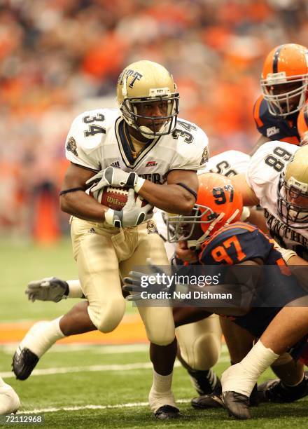 Syracuse, New York Tailback Larod Stephens-Howling of the Pittsburgh Panthers runs against nose tackle Arthur Jones of the Syracuse University Orange...