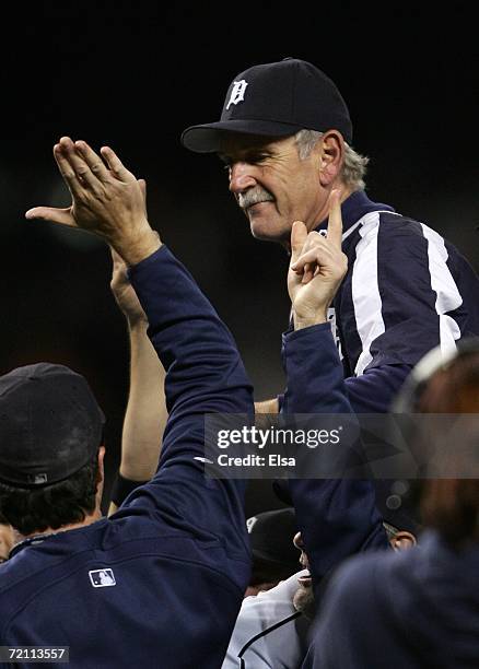 Manager Jim Leyland of the Detroit Tigers is carried off the field by his player as they celebrate after the Tigers recorded the last out to beat the...