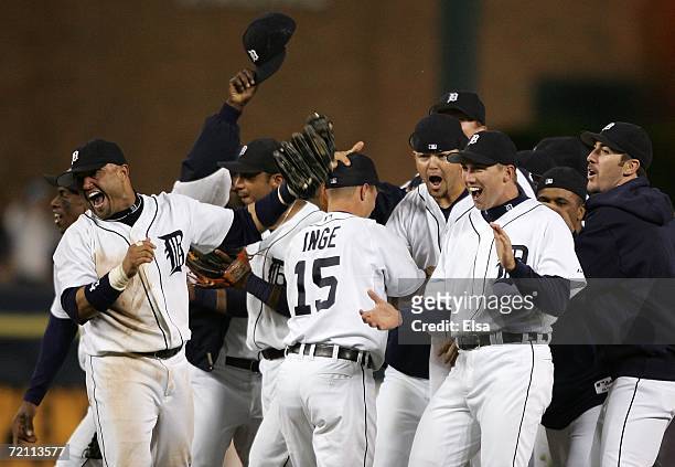 Members of the Detroit Tigers celebrate after the Tigers recorded the last out to beat the New York Yankees 8-3 in Game Four of the 2006 American...