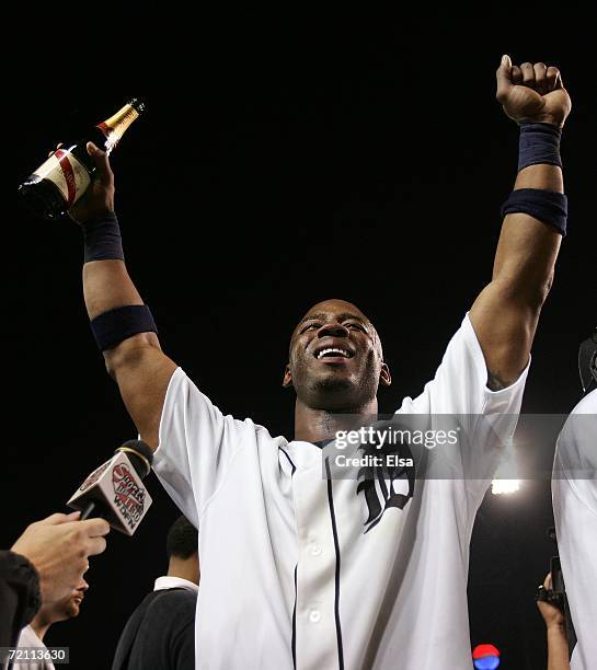 Craig Monroe of the Detroit Tigers celebrates on the field with the fans after Tigers defeated the New York Yankees 8-3. During Game Four of the 2006...