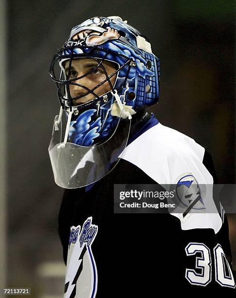 Goaltender Marc Denis of the Tampa Bay Lightning looks toward the bench after giving up the second of two first period goals against the Boston...