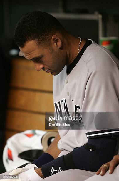 Derek Jeter of the New York Yankees hangs his head in the dugout late in the game against the Detroit Tigers during Game Four of the 2006 American...