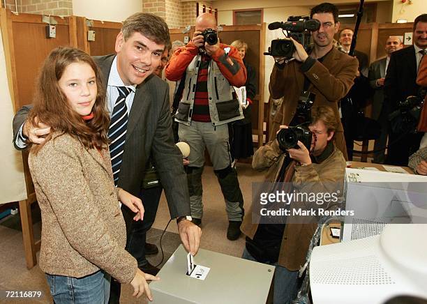 Vlaams Belang frontman Filip Dewinter and daughter Veronique pose as they vote in the regional elections on October 08, 2006 at Ekeren, Antwerp,...