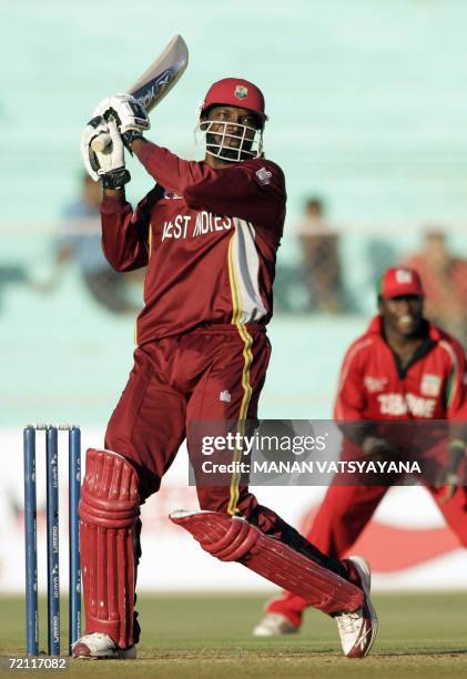 West Indies cricketer Chris Gayle plays a shot during the second qualifying match between Zimbabwe and West Indies at The Sardar Patel Stadium in...