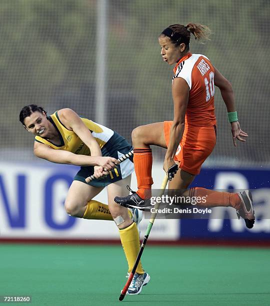 Emily Halliday of Australia is tackled by Sylvia Karres of the Netherlands in the final of the Womens Field Hockey World Cup competition at the Club...
