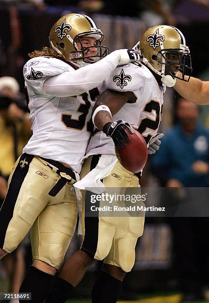 Reggie Bush of the New Orleans Saints celebrates a touchdown with Steve Gleason against theTampa Bay Buccaneers on October 8, 2006 at the Louisiana...