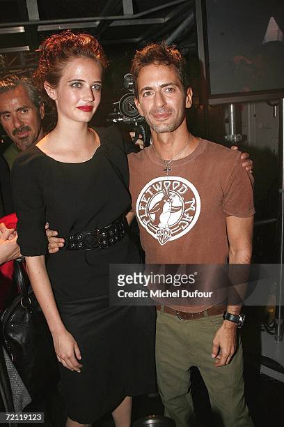 Eva Green and Marc Jacobs pose for a photograph backstage at the Louis Vuitton Fashion Show, as part of Paris Fashion Week Spring/Summer 2007 on...