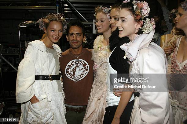 Marc Jacobs poses for a photograph with models backstage at the Louis Vuitton Fashion Show, as part of Paris Fashion Week Spring/Summer 2007 on...