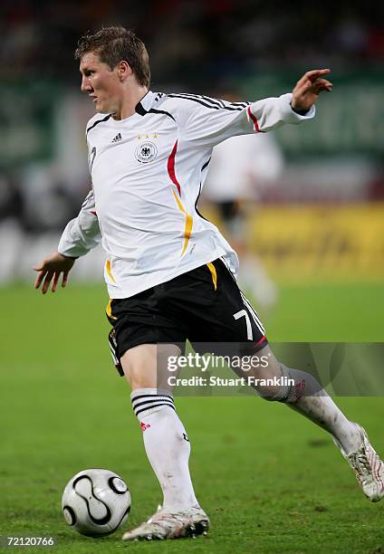 Bastian Schweinstieger of Germany in action during the friendly match between Germany and Georgia at the Ostsee Stadium on October 7, 2006 in...