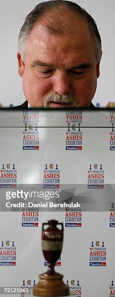 Former English cricket captain Mike Gatting looks at the original Ashes Urn at the launch of the Ashes Exhibition in association with Travelex, at...