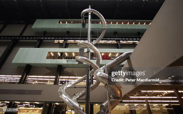 Visitors slide down artist Carsten Holler's installation entitled 'Test Site' at The Tate Modern on October 9, 2006 in London. The work, for the...