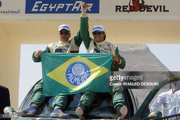 Winner of the second place in the Pharaons International Cross Country Rally, Brazilian driver Paulo Nobre and his conductor Alain Guehennec ,...