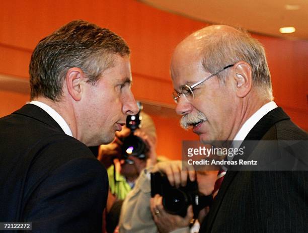 Dieter Zetsche , chairman of DaimlerChrysler AG and Klaus Kleinfeld , President and CEO of Siemens AG, look on prior of the 2nd German energy summit...
