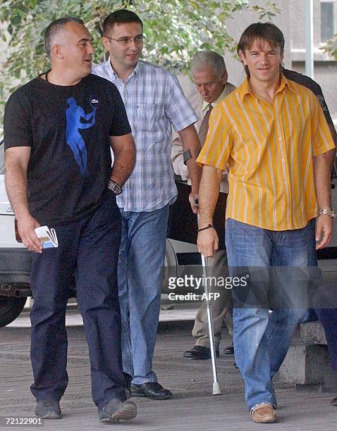 File photo taken 04 October 2006 shows Dobrosav Gavric , Milan Djurisic , and Vujadin Krstic walking to the court in Belgrade. A Belgrade court 09...
