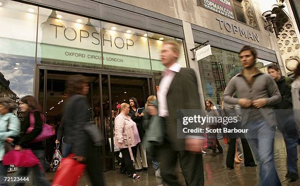 People walk past a Topshop and Topman store on Oxford Street on October 6, 2006 in London, England. The boss of the High Street retailer Topshop, Sir...