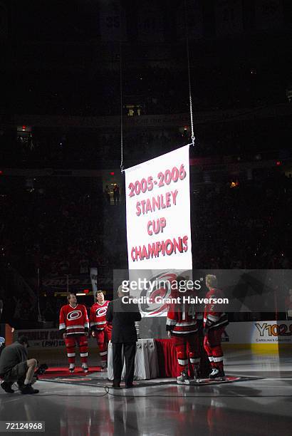 Corey Stillman, Rod Brind'Amour, owner Peter Karmanos, Kevyn Adams and Glen Wesley of the Carolina Hurricanes watch as the 2005-2006 Stanley Cup...