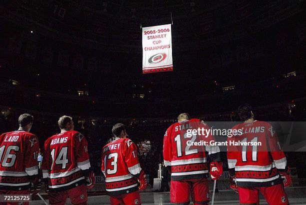 Andrew Ladd; Kevyn Adams,Ray Whitney, Eric Stall; Justin Williams of the Carolina Hurricanes watch as the 2005-2006 Stanley Cup banner is raised...