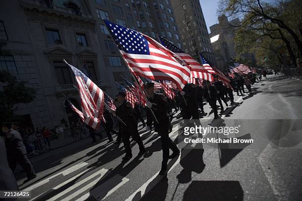 Members of the New York City Fire Department march down Fifth Avenue during the Columbus Day Parade October 9, 2006 in New York City. During the...