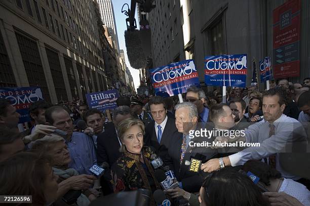 Senator Hillary Rodham Clinton speaks with reporters while behind her Gubernatorial candidate and New York State Attorney General Eliot Spitzer, New...