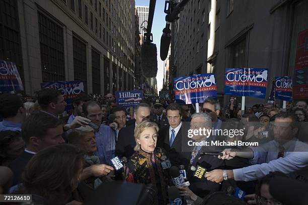 Senator Hillary Rodham Clinton speaks with reporters while behind her Gubernatorial candidate and New York State Attorney General Eliot Spitzer, New...