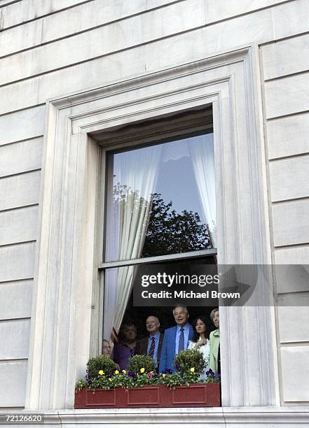 Small crowd watches from a building north of 59th street as Senator Hillary Rodham Clinton marches down Fifth Avenue during the Columbus Day Parade...