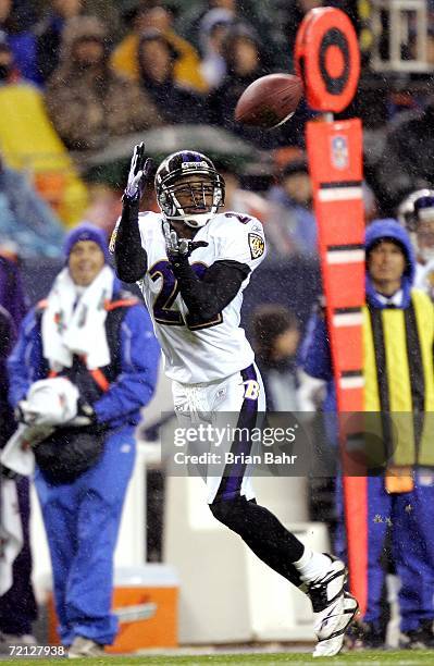 Samari Rolle of the Baltimore Ravens intercepts a pass by quarterback Jake Plummer of the Denver Broncos intended for Javon Walker during the first...