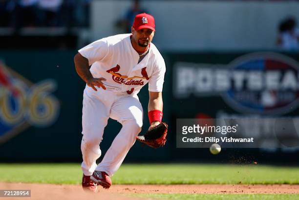 Infielder Albert Pujols of the St. Louis Cardinals fields an out against the San Diego Padres during Game Three of the National League Division...