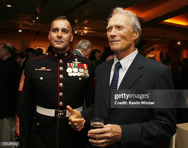 Military Technical Advisor Sgt. Major James Dever, USMC and actor/director Clint Eastwood pose at the afterparty for the premiere of Paramount's...