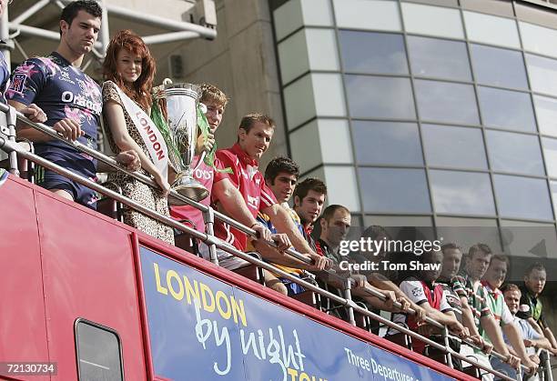 Miss London 2006, Clair Cooper and Players from clubs competeing in the Heineken Cup pose with the trophy on top of a London bus during the launch of...