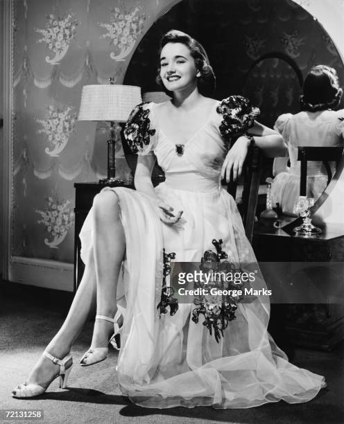 woman in evening gown sitting at vanity table (b&w), portrait - 1940s bedroom stock pictures, royalty-free photos & images