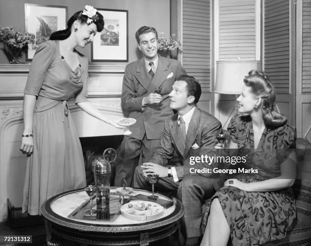 couple entertaining friends (b&w) - 1950 bildbanksfoton och bilder