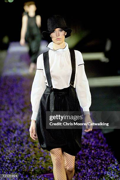 Model walks down the catwalk during the Yves Saint Laurent Fashion Show as part of Paris Fashion Week Spring/Summer 2007 on October 5, 2006 in Paris,...