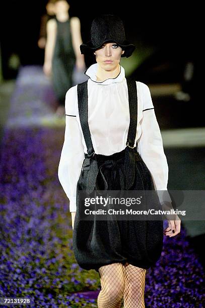 Model walks down the catwalk during the Yves Saint Laurent Fashion Show as part of Paris Fashion Week Spring/Summer 2007 on October 5, 2006 in Paris,...