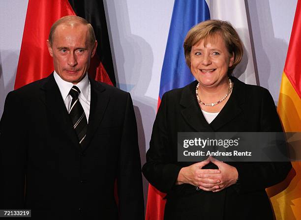 German Chancellor Angela Merkel and Russian President Vladimir Putin attend a news conference after bilateral talks on October 10, 2006 in Dresden,...