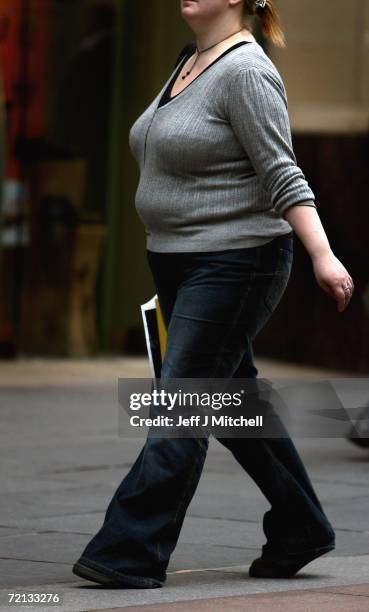 An overweight person walks through Glasgow city centre on October 10, 2006 in Glasgow, Scotland. According to government health maps published today,...